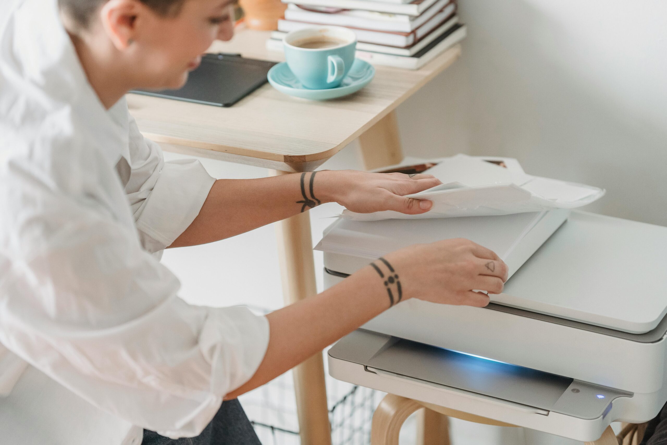 Laptop and printer in home office setting