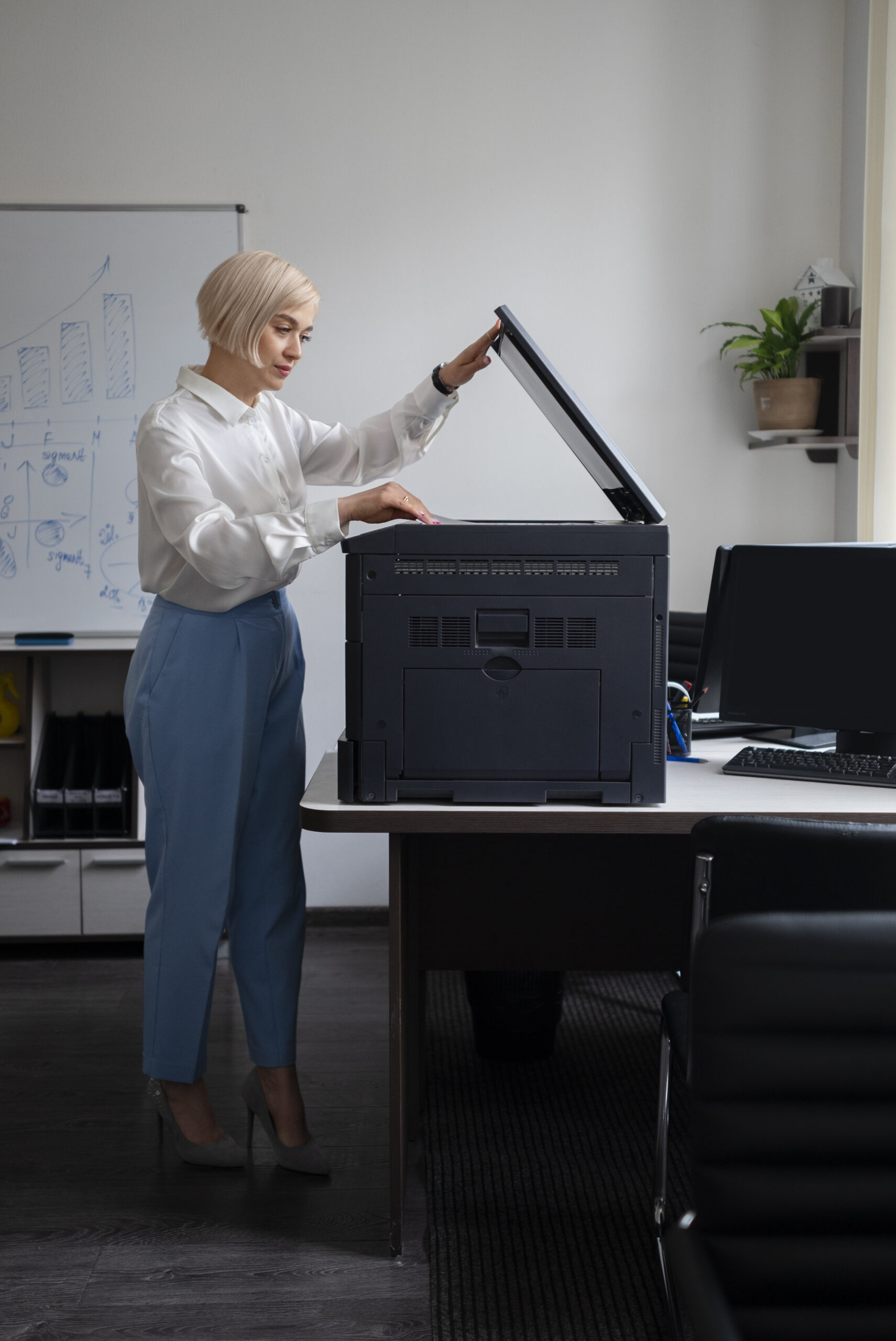 Woman working at office printer